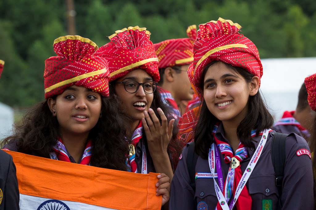 Female Scouts from an Asian country pose for the camera at World Scout Jamboree 2019